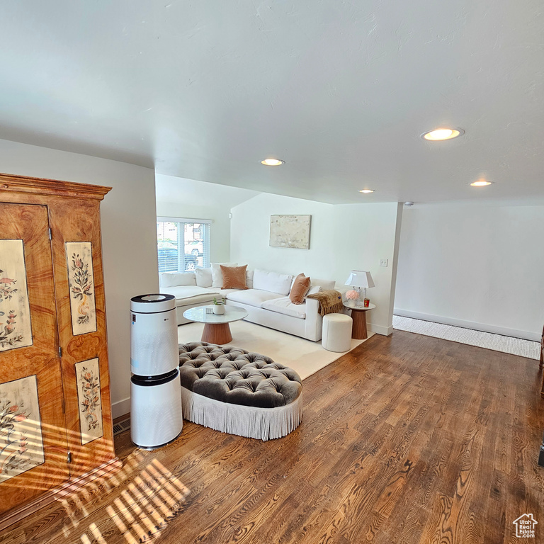 Interior space with dark wood-type flooring and baseboard heating