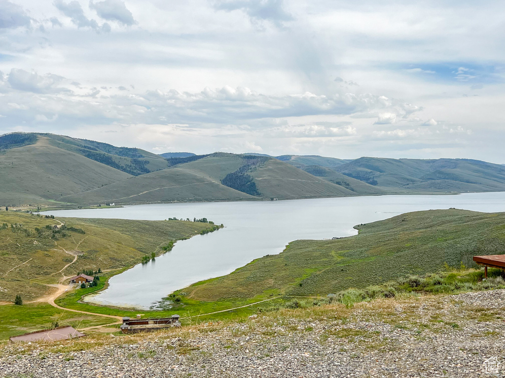 Mountain view featuring a water view