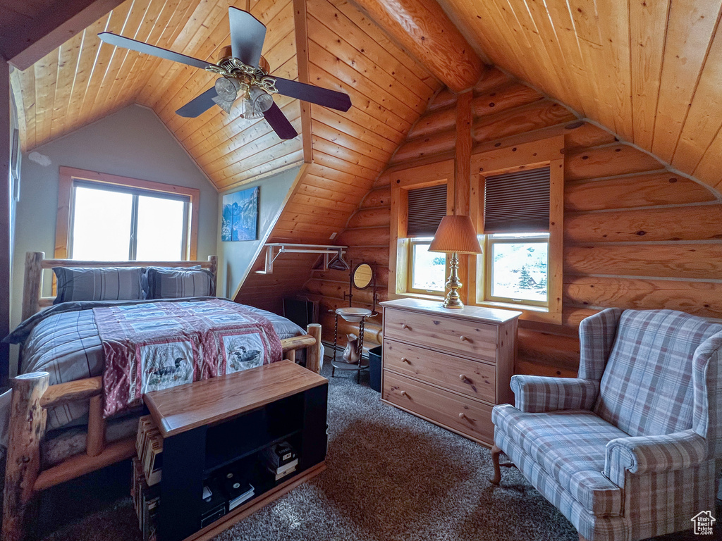 Carpeted bedroom featuring vaulted ceiling with beams, wood ceiling, log walls, and ceiling fan