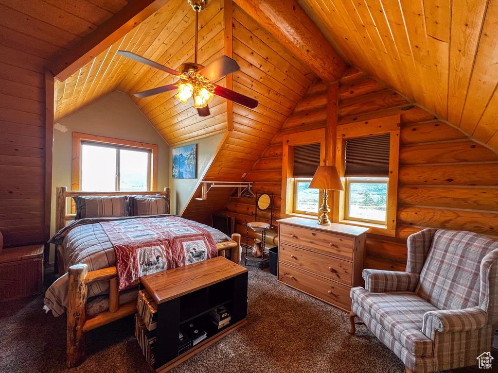 Carpeted bedroom with lofted ceiling with beams, log walls, and wood ceiling