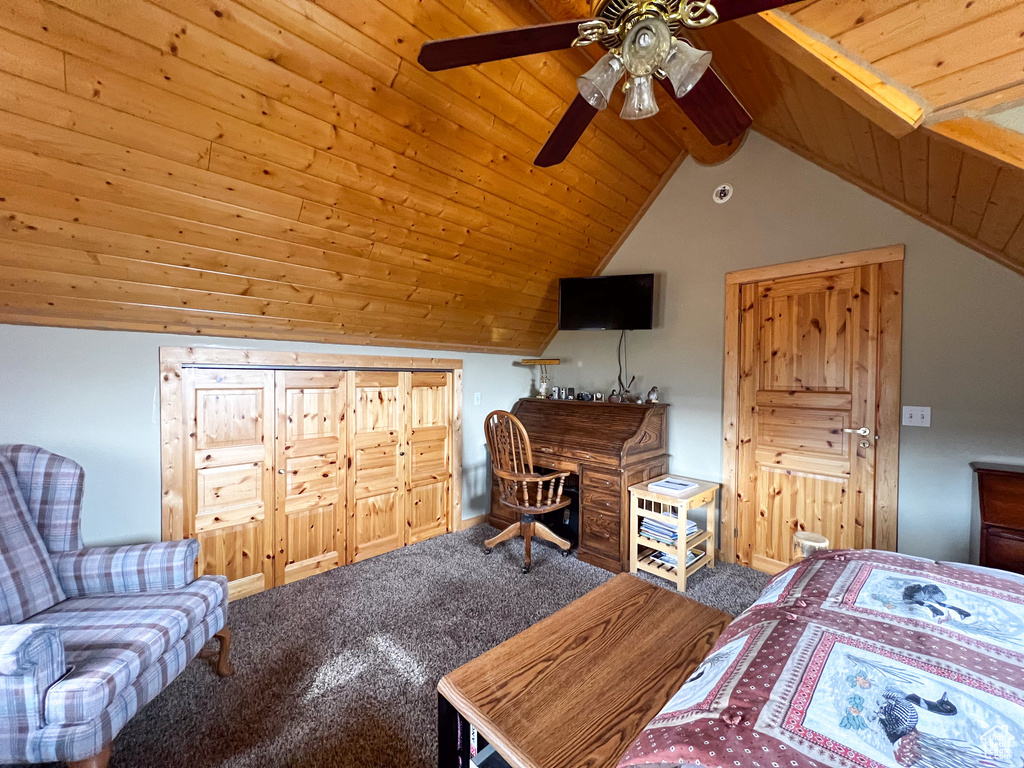 Carpeted bedroom with wooden ceiling, lofted ceiling, and ceiling fan