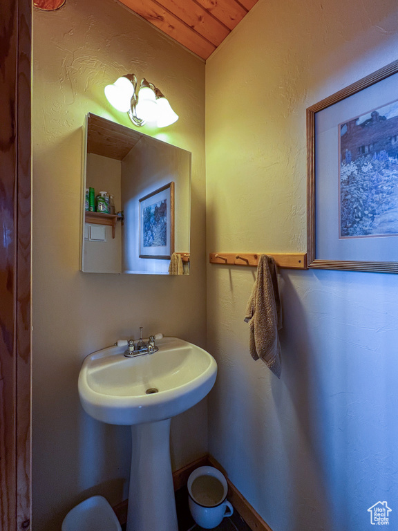 Bathroom featuring wooden ceiling