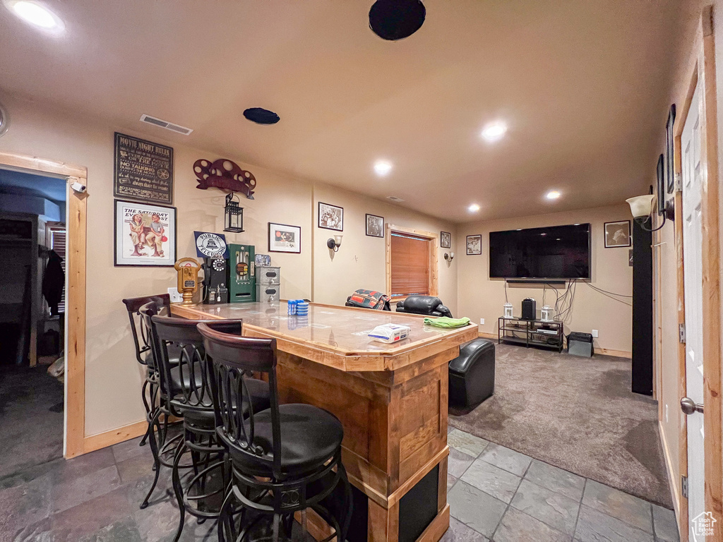 Bar featuring tile patterned floors