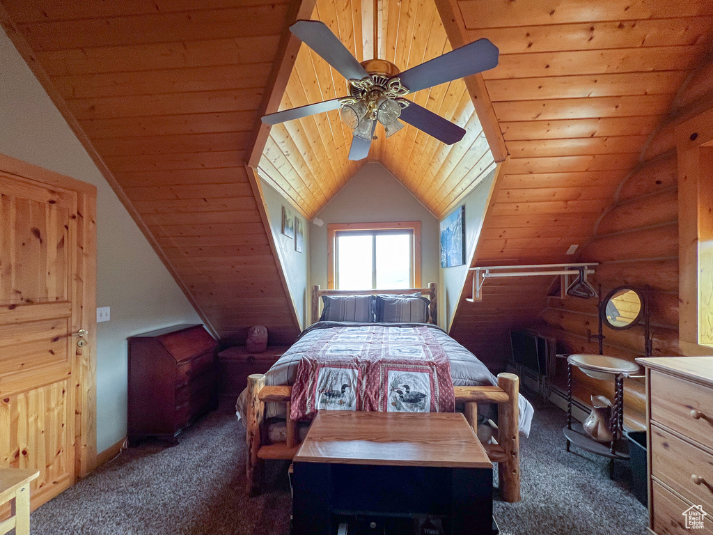 Bedroom with carpet flooring, rustic walls, wood ceiling, ceiling fan, and vaulted ceiling