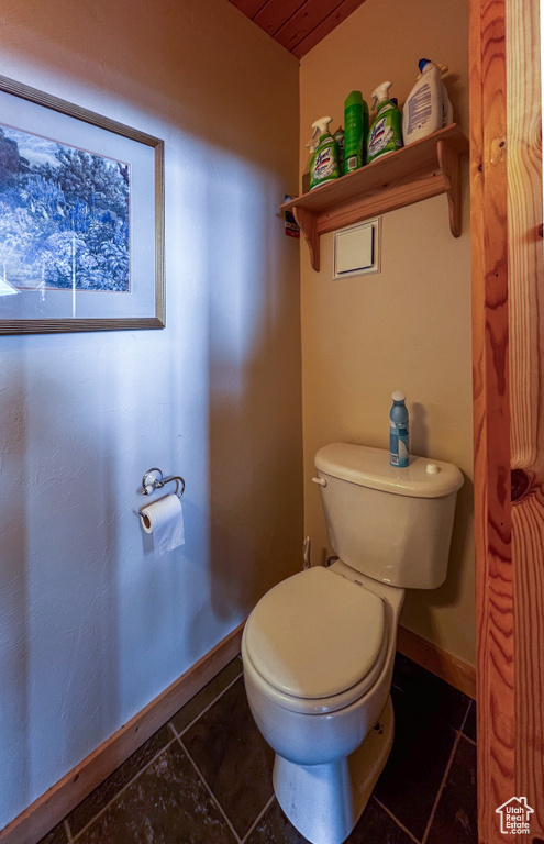 Bathroom with tile patterned flooring and toilet