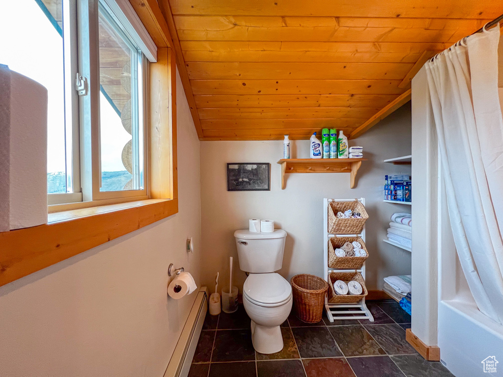 Bathroom with tile patterned flooring, toilet, wood ceiling, baseboard heating, and vaulted ceiling