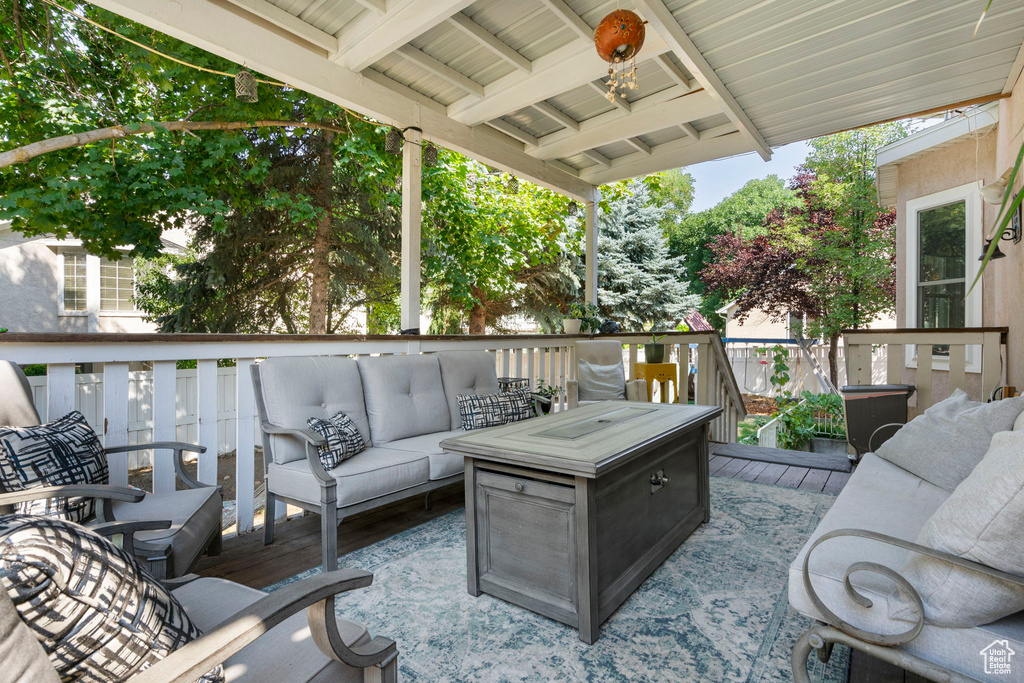 Wooden deck featuring an outdoor living space