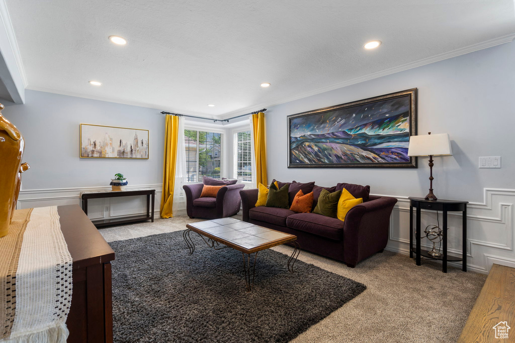 Living room with light colored carpet and crown molding