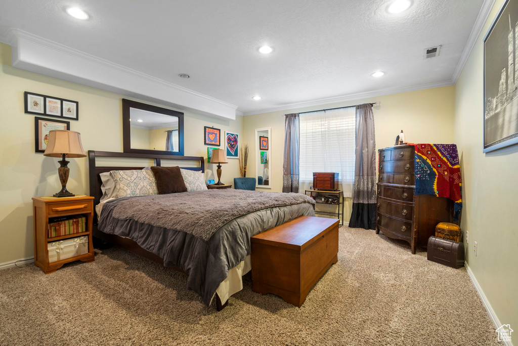 Bedroom with carpet and crown molding