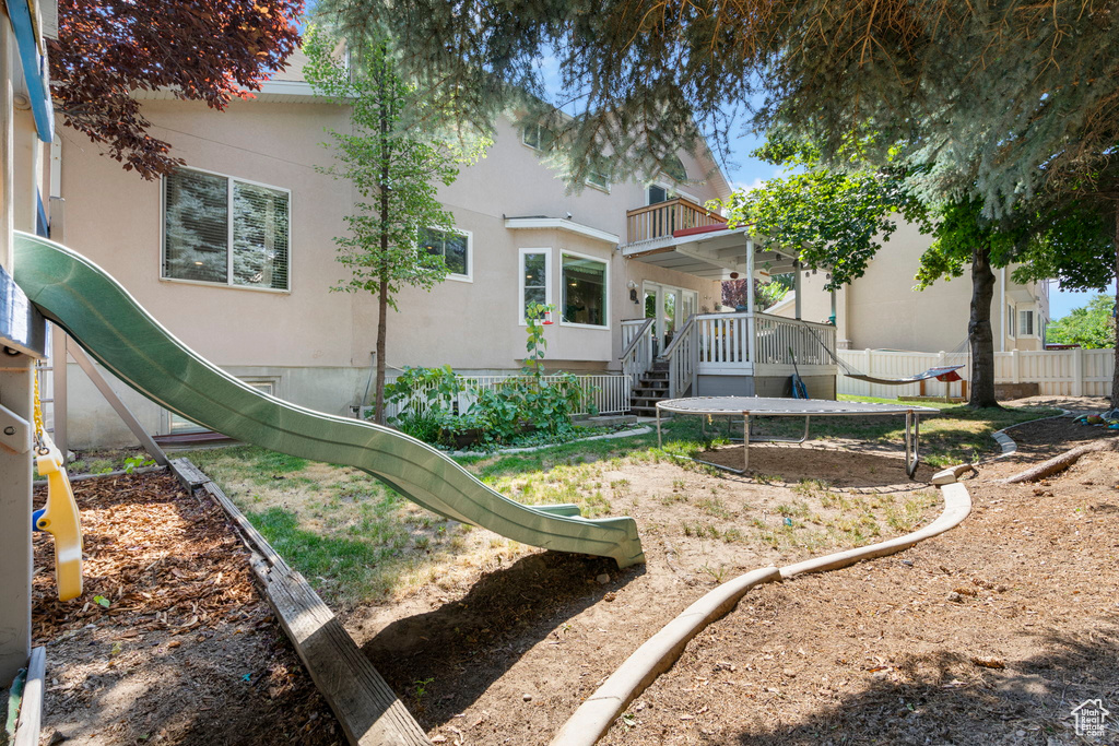 Back of property featuring a balcony