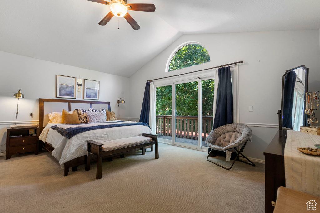 Carpeted bedroom with access to exterior, high vaulted ceiling, and ceiling fan