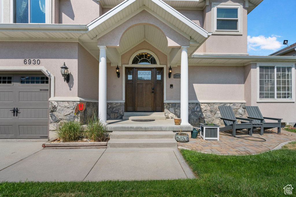 Property entrance featuring a garage