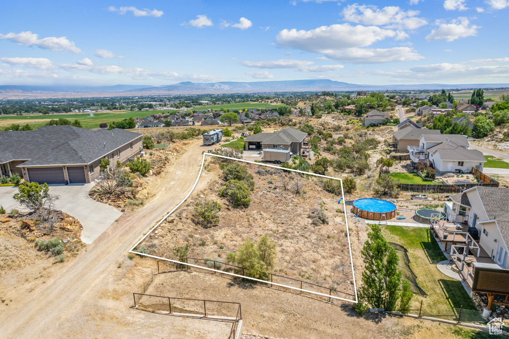 Birds eye view of property featuring a mountain view