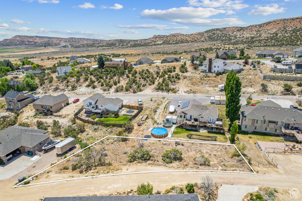 Birds eye view of property with a mountain view