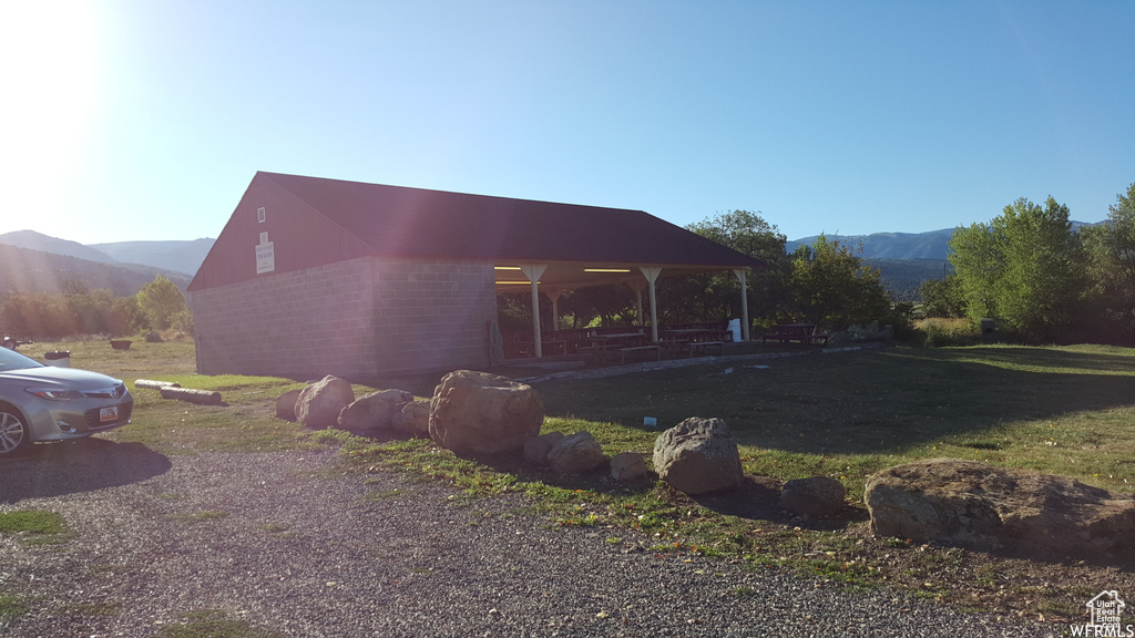 View of side of property with a mountain view