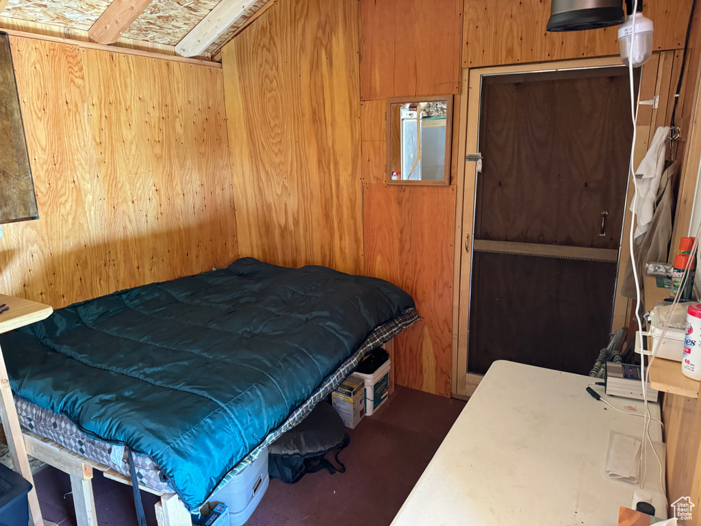 Bedroom with wooden walls