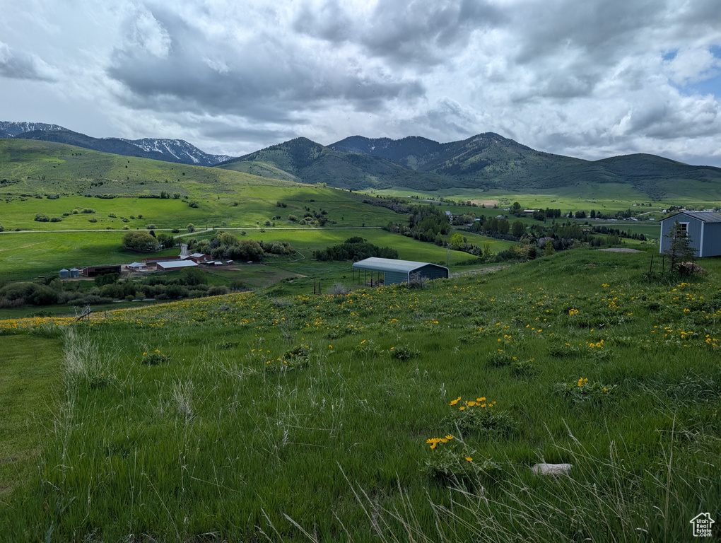 View of mountain backdrop with rural landscape