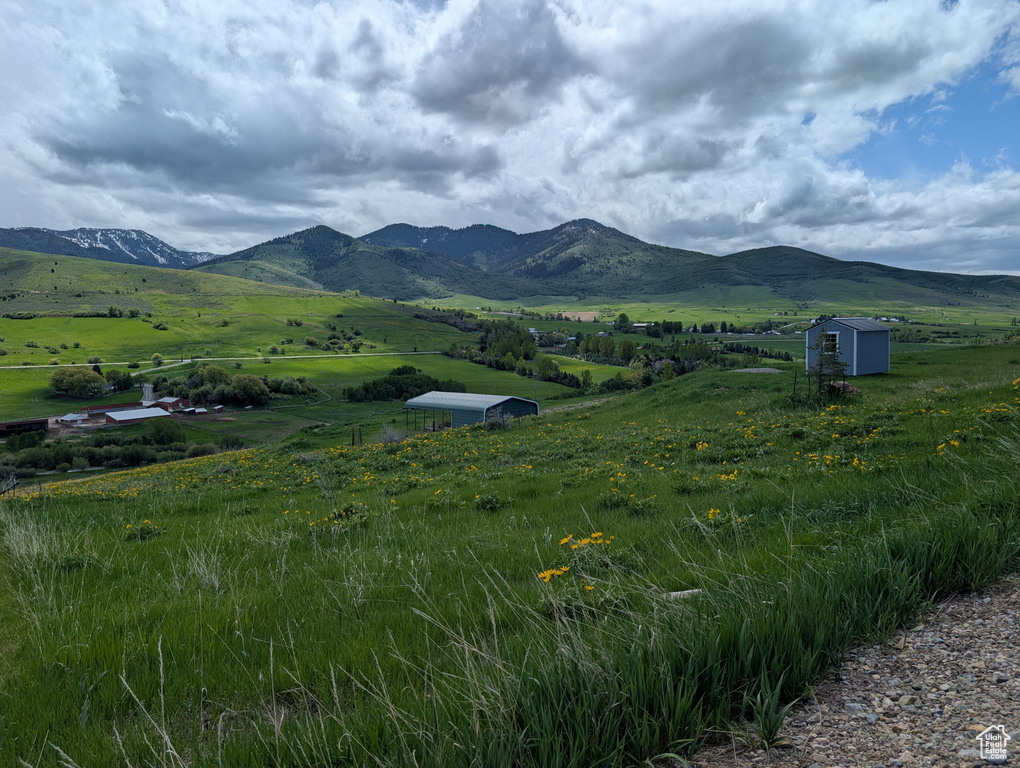 View of mountain backdrop featuring rural landscape