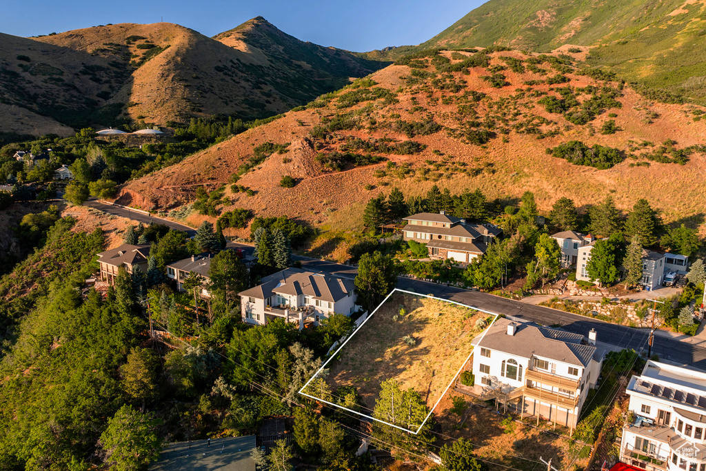 Birds eye view of property with a mountain view