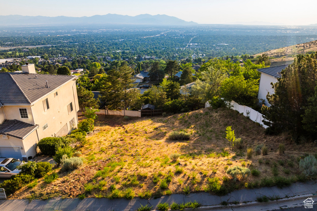 Birds eye view of property with a mountain view