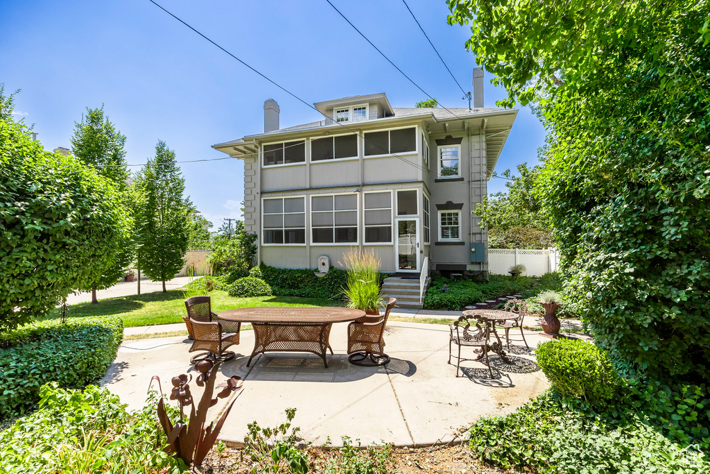 Rear view of house featuring a patio area