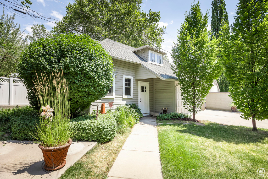 View of front of property with a front lawn