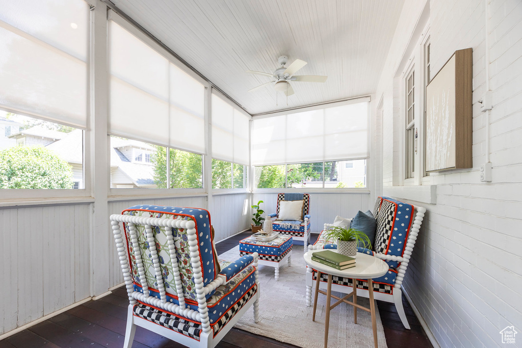 Sunroom / solarium featuring ceiling fan