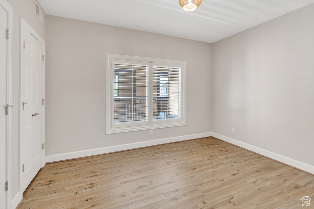 Unfurnished room with light hardwood / wood-style flooring