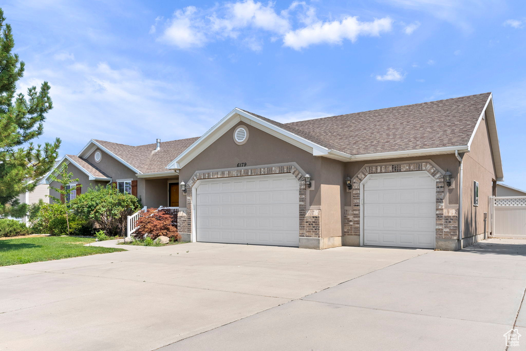 Ranch-style home with a garage