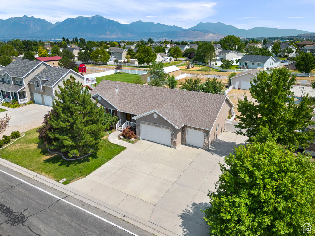 Birds eye view of property with a mountain view