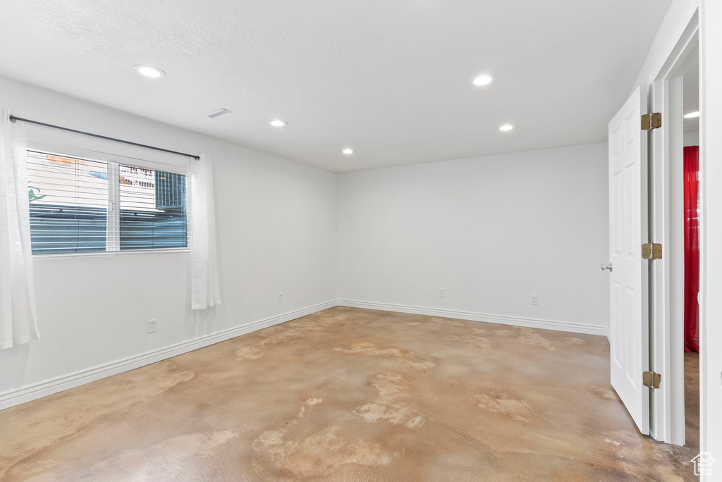 Spare room with concrete floors