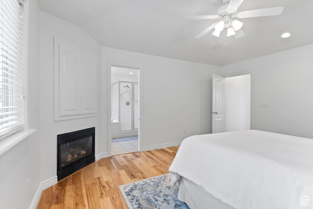 Bedroom with ceiling fan and light hardwood / wood-style floors