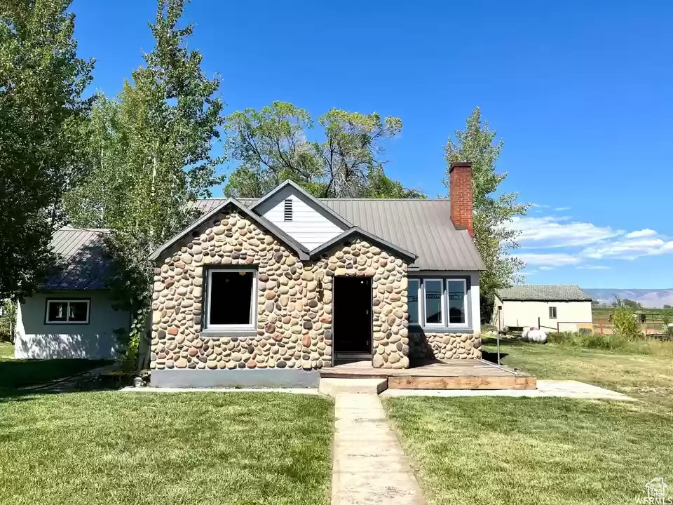 View of front of home with a front yard