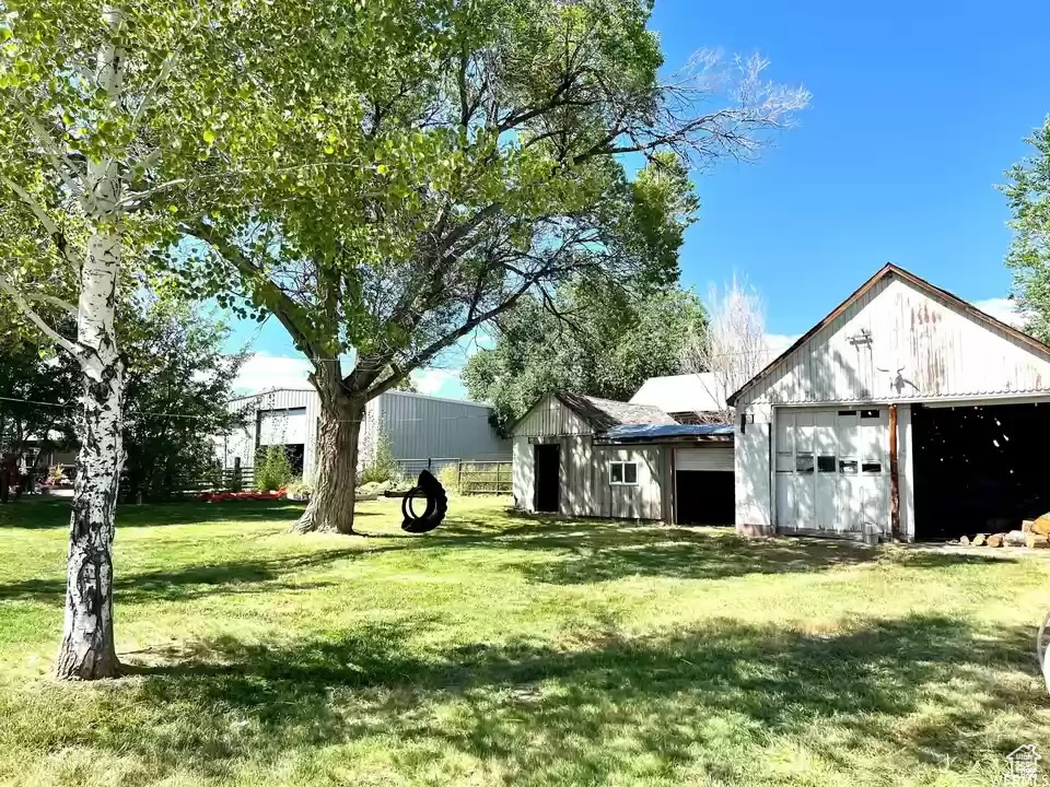 View of yard with a garage