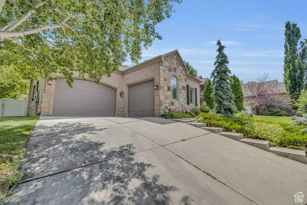 View of front facade featuring a garage