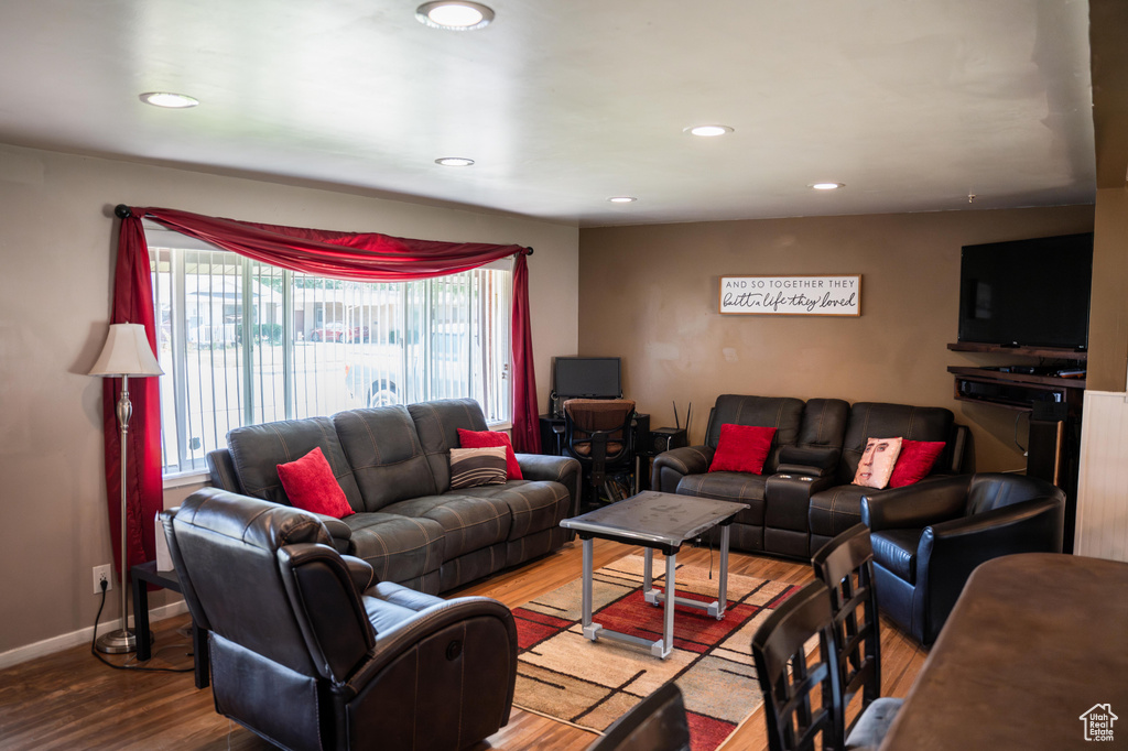 Living room featuring hardwood / wood-style floors and a wealth of natural light