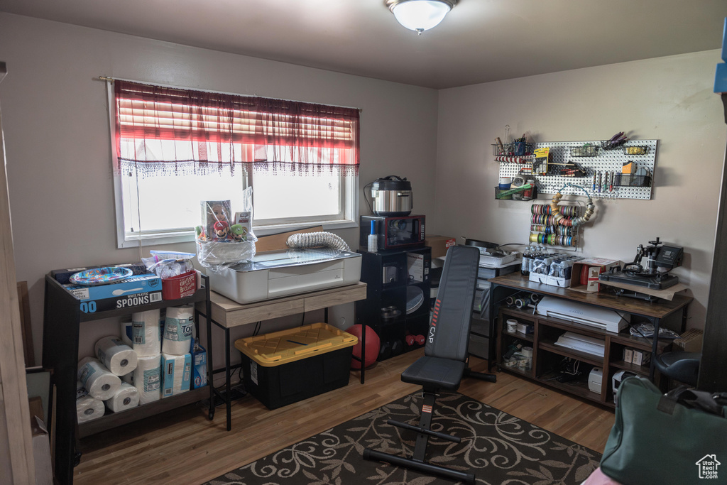 Office area with hardwood / wood-style floors