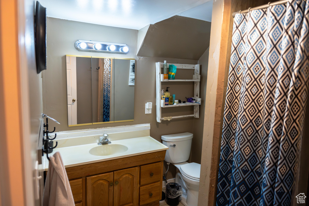 Bathroom with toilet and vanity