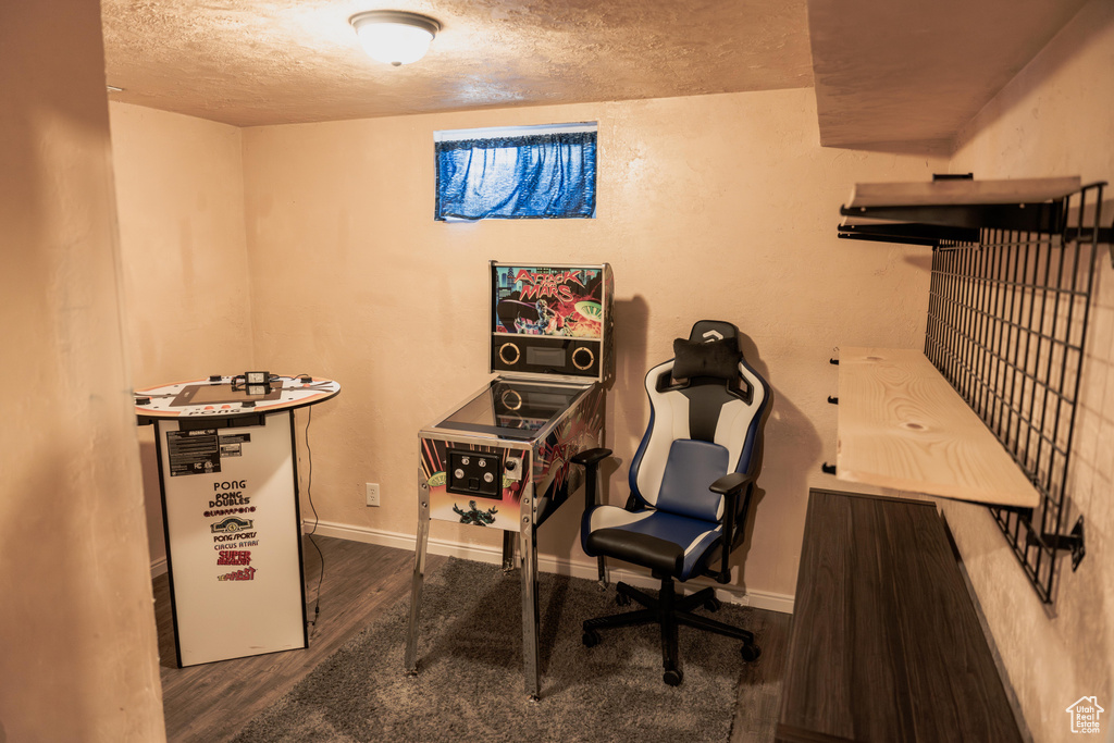 Office area featuring wood-type flooring and a textured ceiling