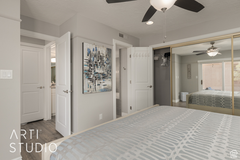 Bedroom with ceiling fan, hardwood / wood-style floors, and a closet