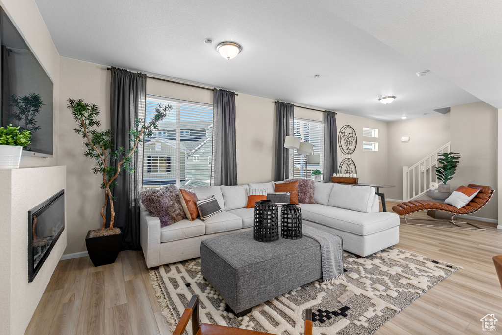 Living room with light wood-type flooring