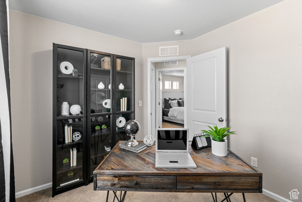 Office area with light colored carpet