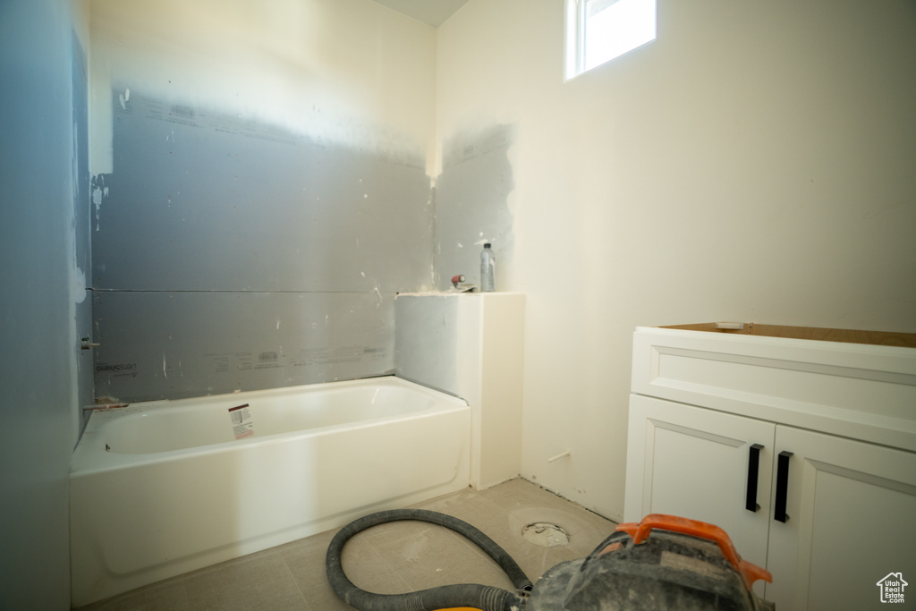 Bathroom with a washtub