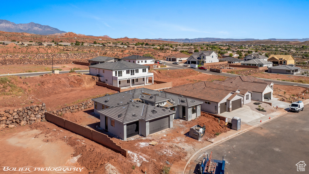 Birds eye view of property featuring a mountain view