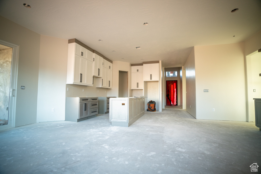 Kitchen featuring white cabinets