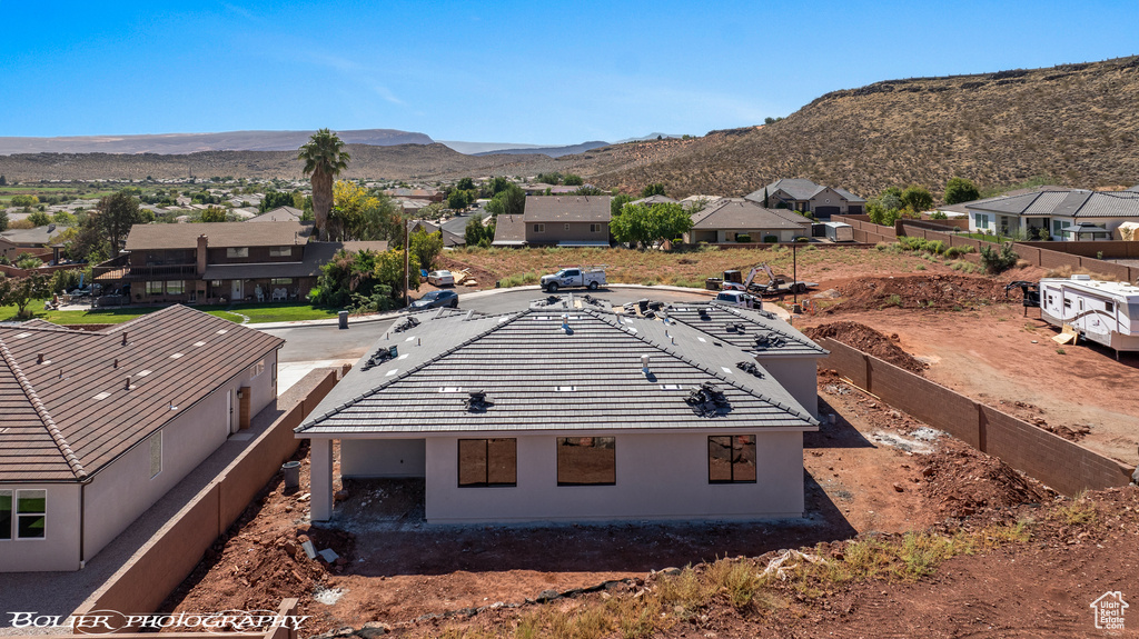 Birds eye view of property with a mountain view