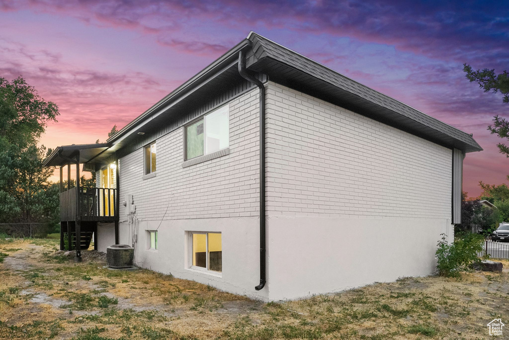 View of property exterior at dusk