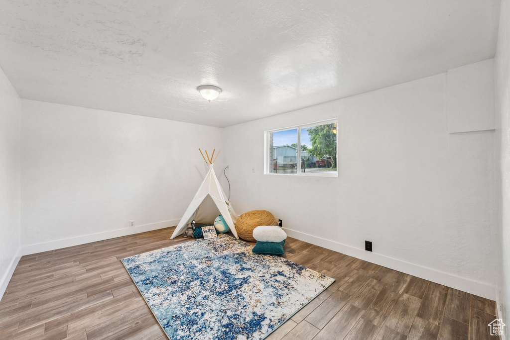 Recreation room featuring wood-type flooring