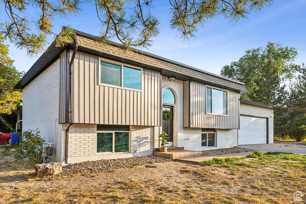 Split foyer home featuring a garage