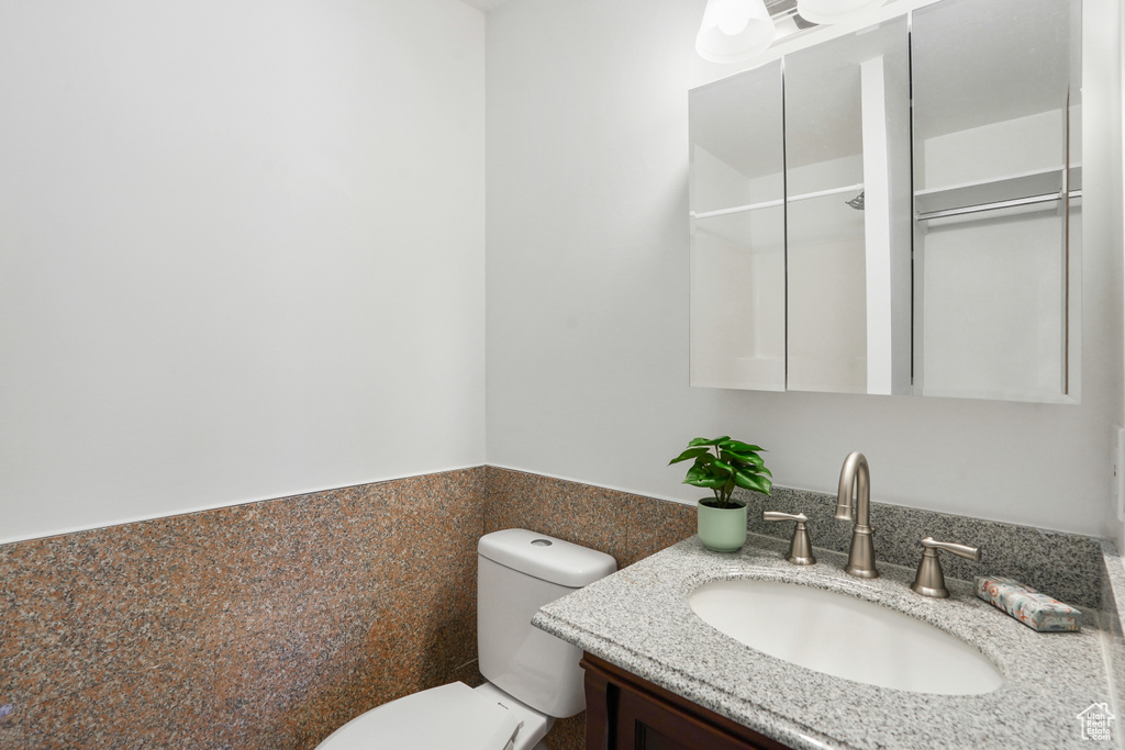 Bathroom featuring toilet and vanity